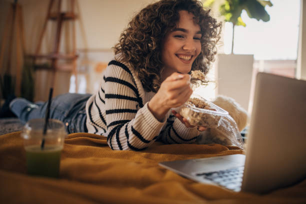 istock Young woman eating healthy 1367997843