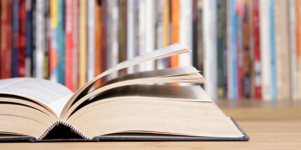 istock Open book close up at the library 1367999194