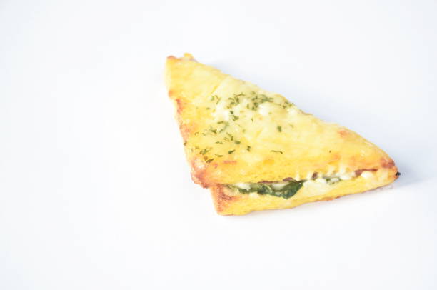 baking sandwich with cheese stuffed ham and mashed spinach on white background