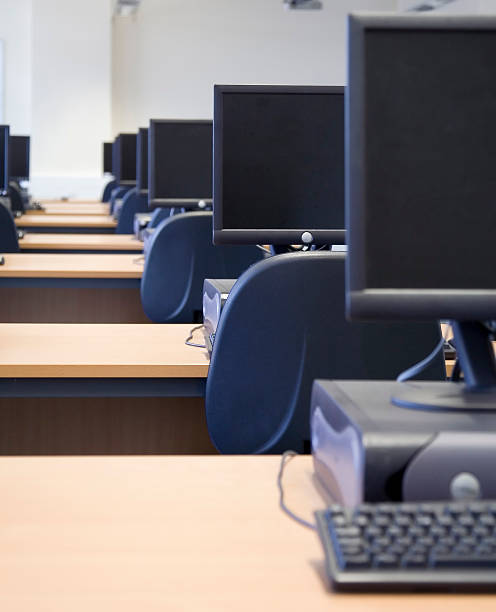 istock Rows of computers and keyboards on desks 136800039