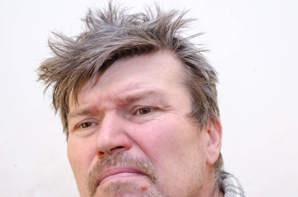 istock Portrait of a brooding gigolo with disheveled, uncombed hair. 1368000775