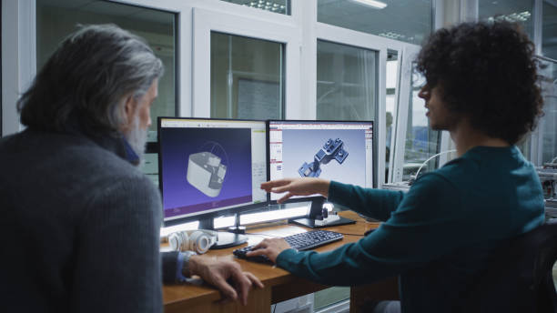 istock Male colleagues discussing 3D models 1368001948