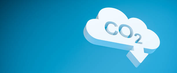 CO2 reduction concept. A cloud shaped object with the word CO2 punched out and an arrow pointing down in front of a blue background. Web banner format stock photo