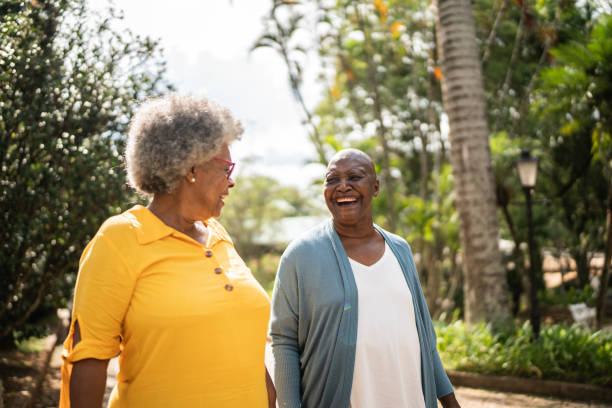 istock Senior women talking and walking outdoors 1368002955