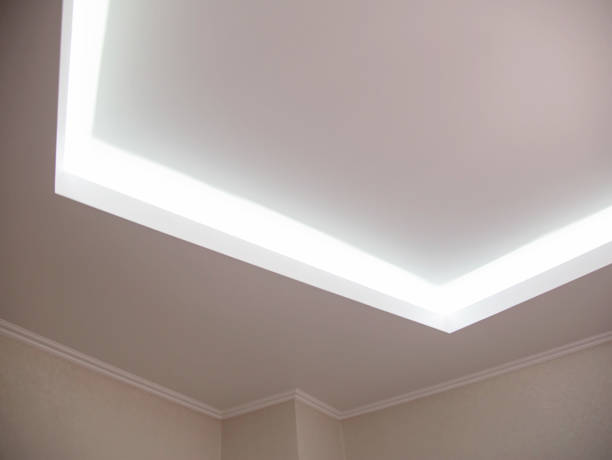 istock Parts of a designer stretch ceiling with diode lighting. Modern ceiling renovation, interior 1368003184