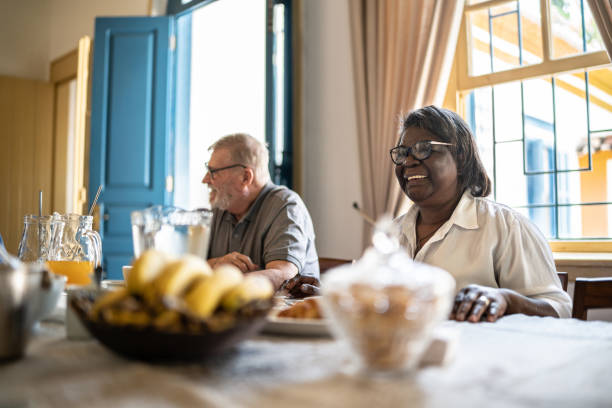 istock Happy senior couple having breakfast together 1368003441