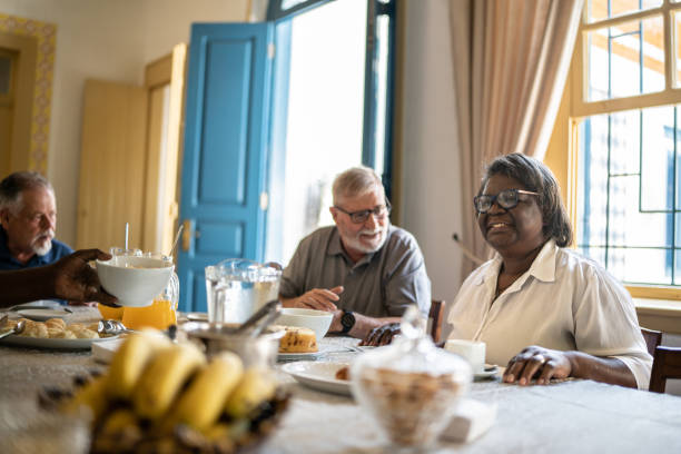 istock Senior friends enjoying a breakfast together at hotel 1368004335