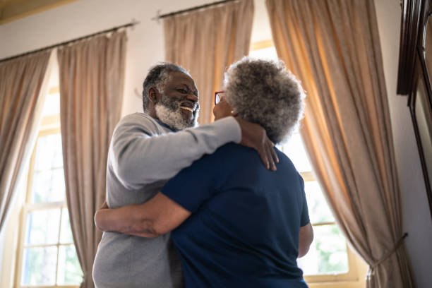 istock Senior couple dancing at home 1368004799