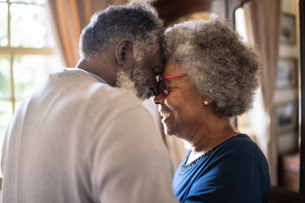 istock Senior couple dancing at home 1368004804