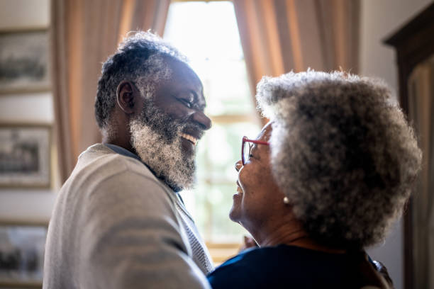 istock Senior couple dancing at home 1368004812