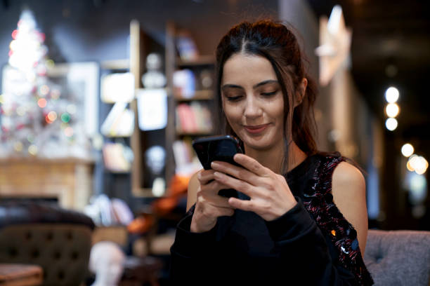 istock Beautiful girl texting in cafe  in Ankara, Turkey. 1368005703