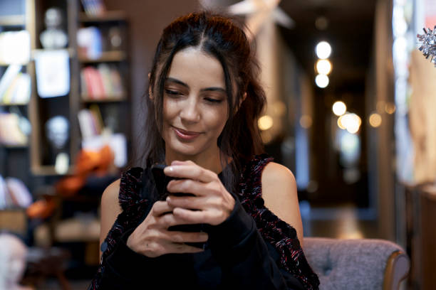 istock Beautiful girl texting in cafe  in Ankara, Turkey. 1368005705