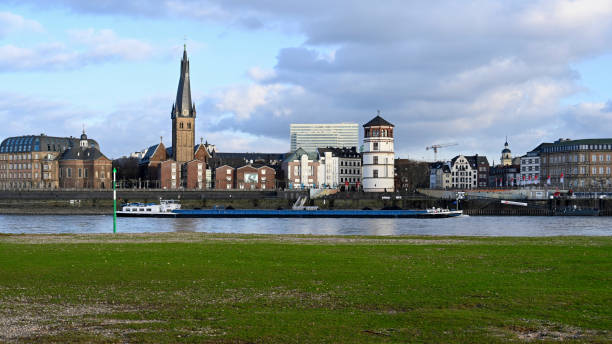 Duesseldorf, Germany, January 28, 2022 - Skyline of Duesseldorf downtown with St. Lambertus and  Schlossturm seen from Oberkassel