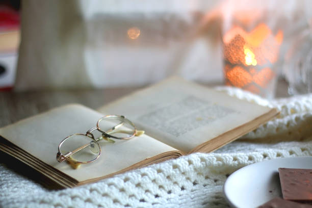 istock Chocolate, Cookies, Book, Glasses and Blanket 1368007280