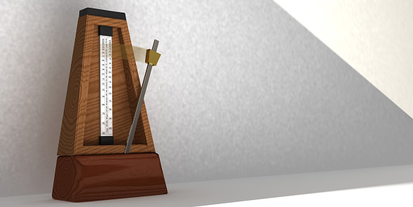 3D Illustration of metronome with pendulum in motion