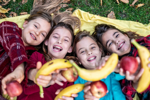 istock Four girls are on a picnic 1368008709