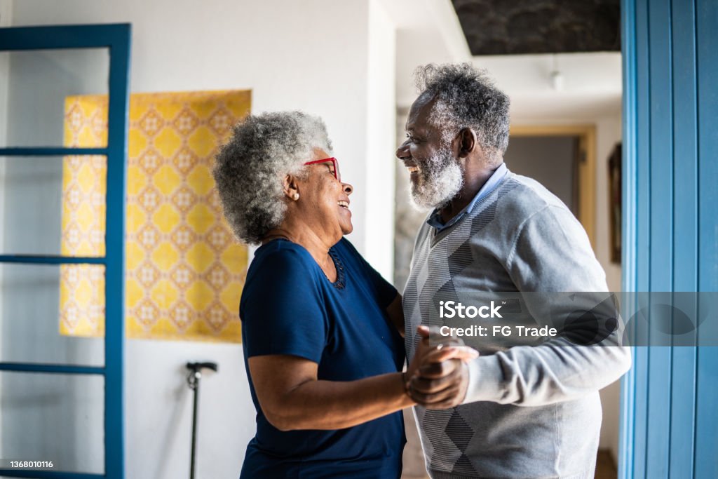 Senior couple dancing at home Dancing Stock Photo