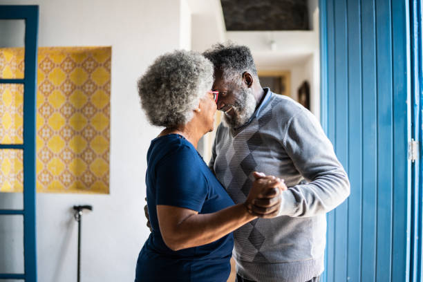 istock Senior couple dancing at home 1368010169