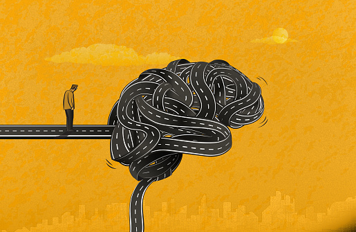 The man facing a brain-shaped knot formed by tangled roads. (Used clipping mask)