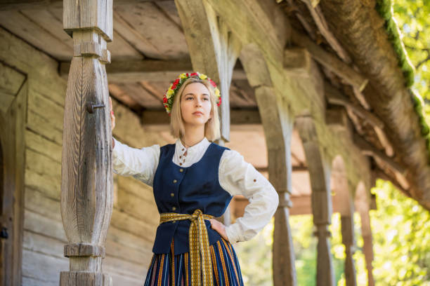 Latvian woman in traditional clothing. Ligo folk. stock photo