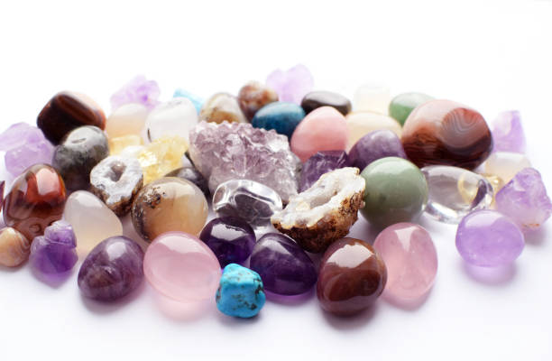 istock Gems of different colors. Amethyst, rose quartz  lie on a white background. 1368012606