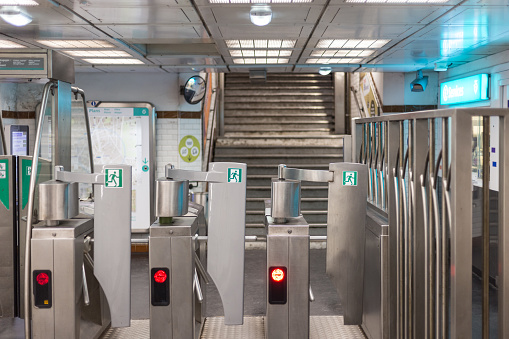 Fare gates in an underground metro station in Paris France