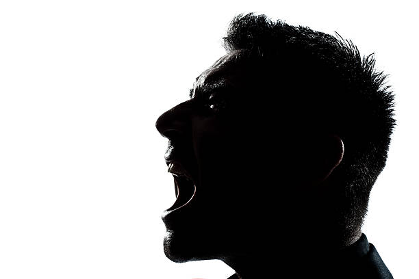 istock silhouette man portrait profile screaming angry 136801457