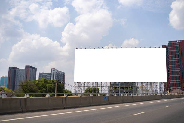 istock Blank white road billboard with Bangkok cityscape background at day time. 1368016110