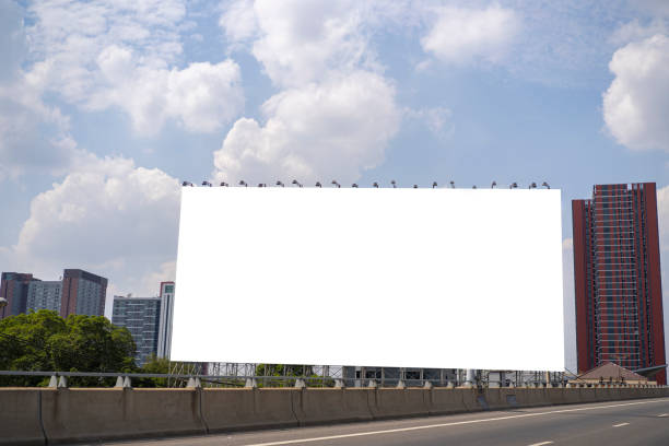 istock Blank white billboard against the blue sky 1368016136