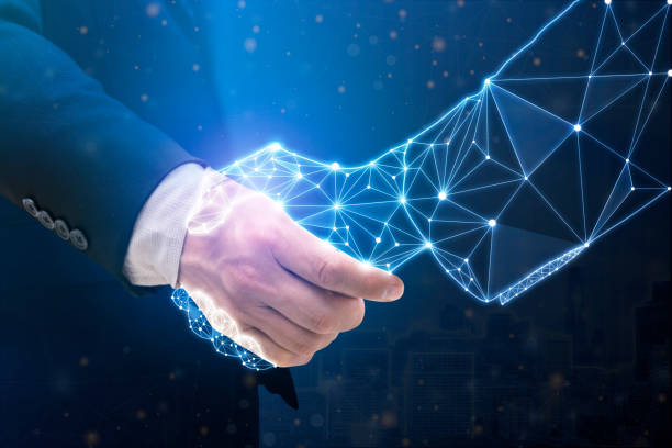 Businessperson shaking hand with digital partner over futuristic background. Businessperson shaking hand with digital partner over futuristic background. Artificial intelligence and machine learning process for 4th industrial revolution. ai stock pictures, royalty-free photos & images