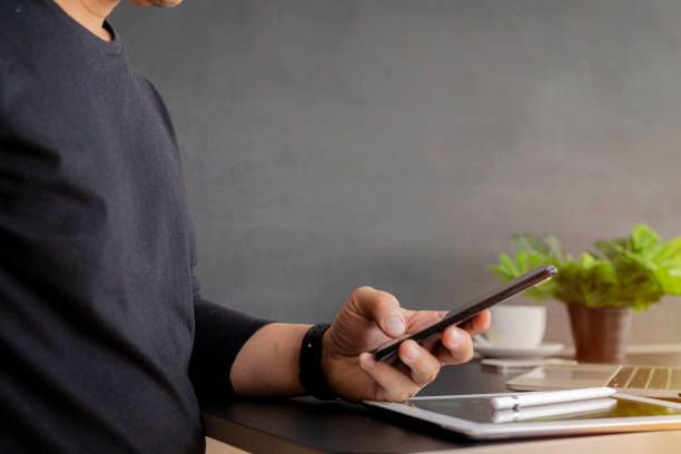 istock close up of a man using a smart cell phone 1368016173