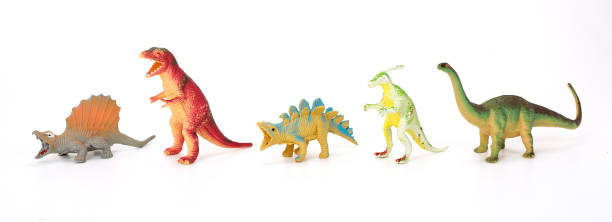 istock Various dinosaurs from prehistoric times in a row on white background. 1368017150