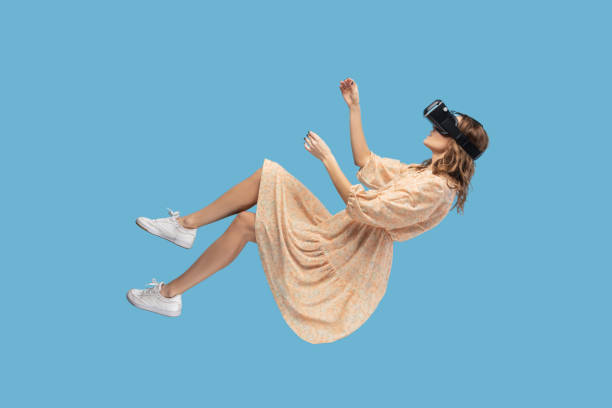 istock girl levitating with virtual reality glasses, playing game with vr headset, floating in cyberspace 1368017264