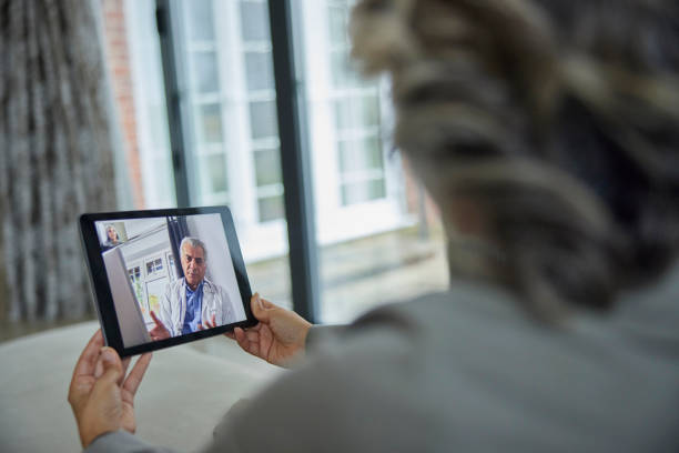 istock Woman Having Remote Consultation With Doctor At Home Using Digital Tablet 1368017407