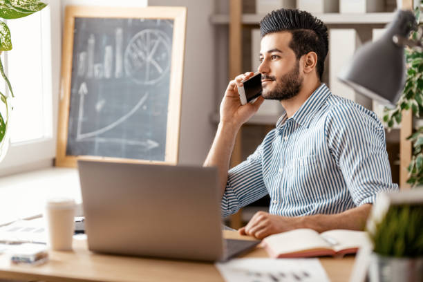 istock man working on a laptop at home. 1368017613