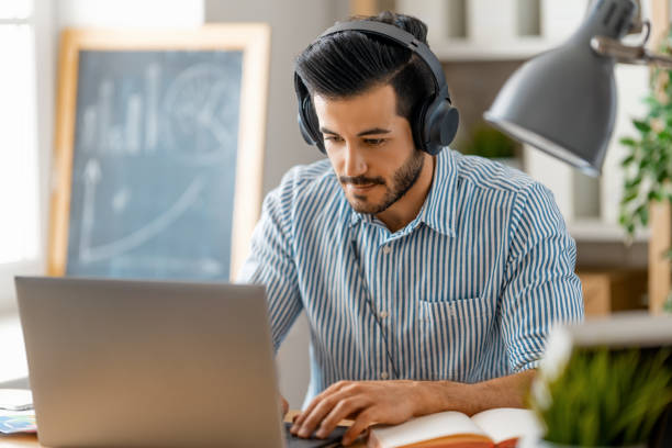 istock man working on a laptop at home. 1368018527