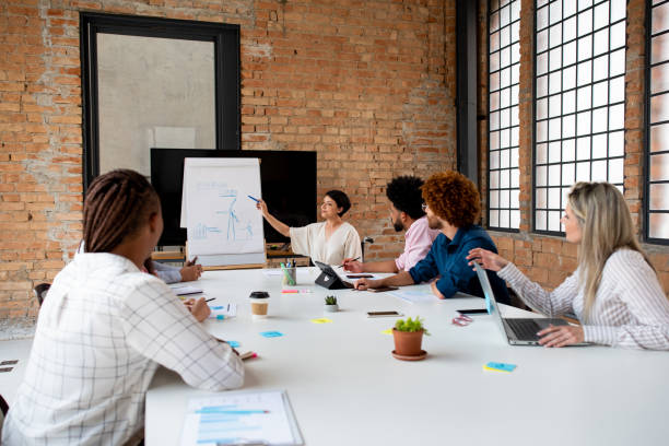 istock Work meeting - disabled person using wheelchair 1368018684
