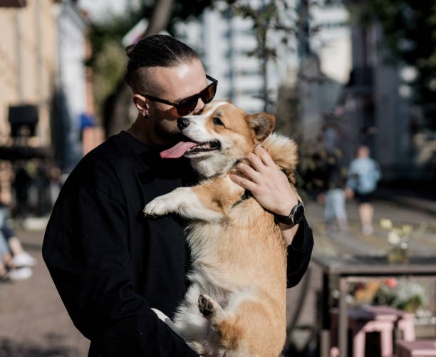 istock Man kissing dog 1368020397