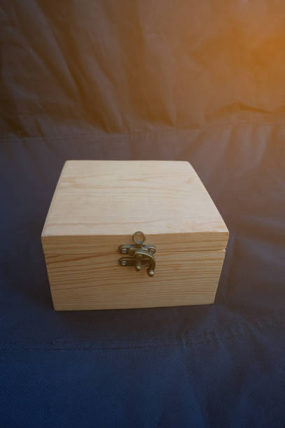 istock Luxury pine wood gift box on a dark background. 1368021727