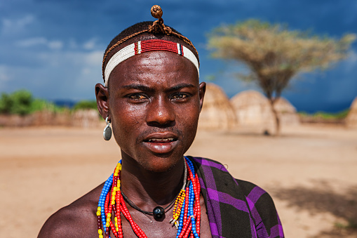 Portrait of young man from Erbore tribe. The Erbore (Arbore) tribe is a tribe that lives in the southwest region of the Omo Valley near Kenya, Africa.