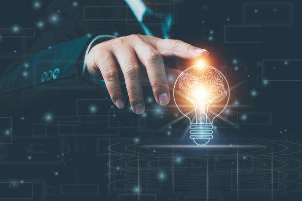 istock Light bulb with brain inside the hands of the businessman and point connecting network background. Creative The brain in the light bulb, The concept of the business idea. 1368026990