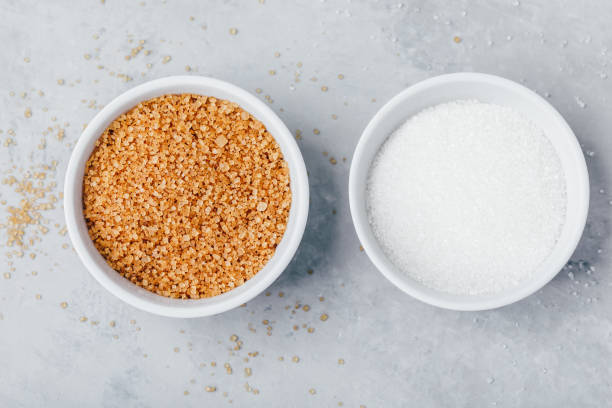 istock White sugar in bowl on gray stone background 1368027180