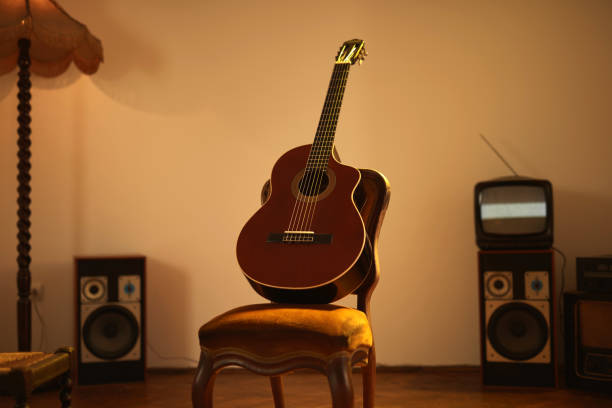 istock Acoustic guitar in a retro vintage room. 1368028861