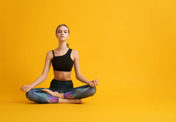 istock Woman is practicing yoga and meditation 1368031889