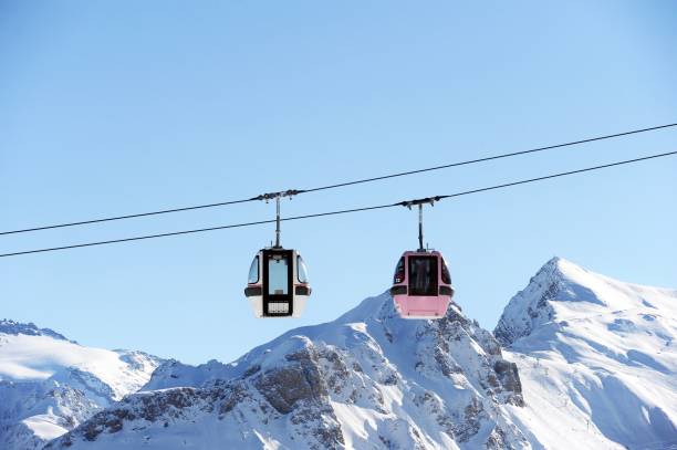 istock Vintage ski gondolas over the snowy mountains 1368032391