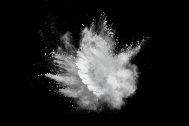 white powder explosion on black background. - speed snow textured textured effect imagens e fotografias de stock