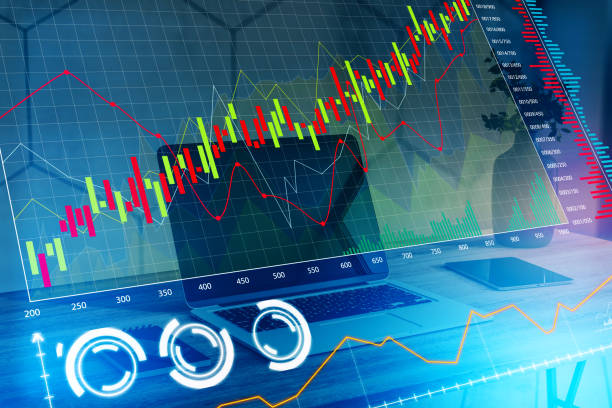 istock Close up of workplace with notebook computer and creative glowing forex chart on blurry background. Finance, trade and trend concept. 3D Rendering and Double exposure. 1368035680