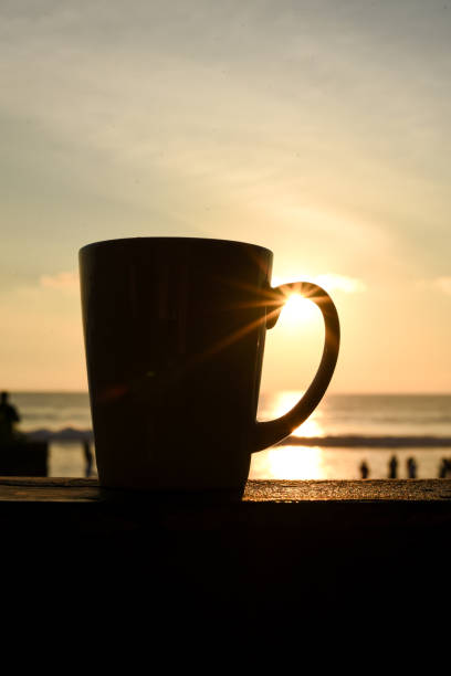 istock a cup of coffee at sunset 1368036479