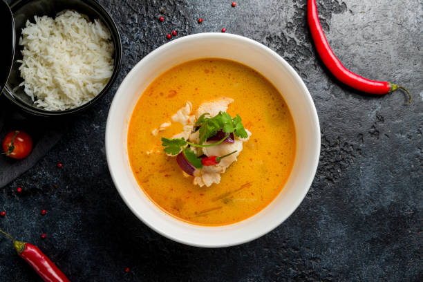 istock Tom Yam soup with chicken on bowl on dark stone table top view 1368038265