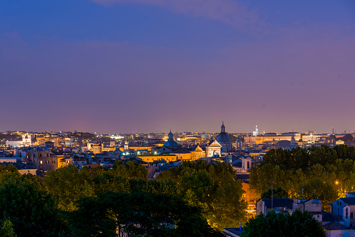 Roman citscape panorama at dusk, Rome Italy. Seen from the Trastevere hill.